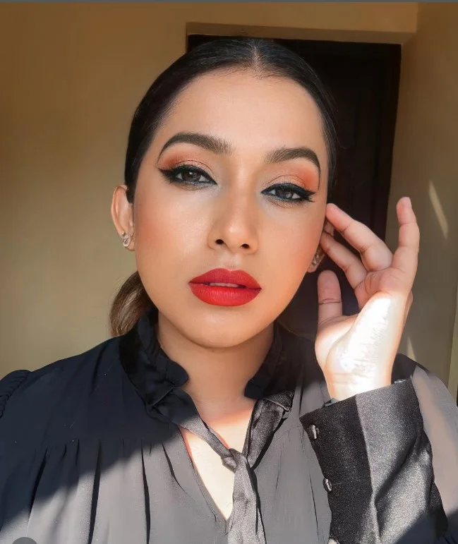 Cherry red lipstick that creates a timeless statement look and brightens olive skin beautifully.