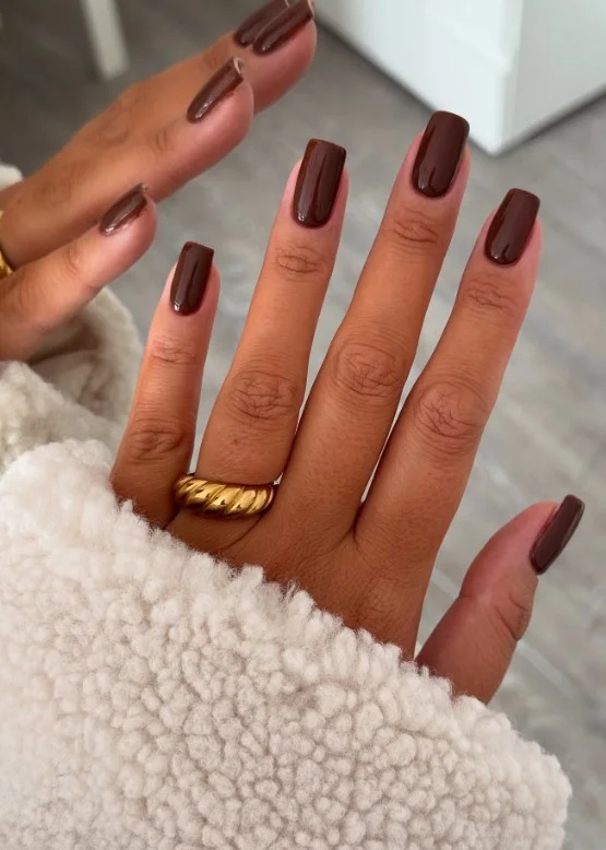 Chocolate brown square nail designs with a smooth glossy finish for a rich elegant manicure.