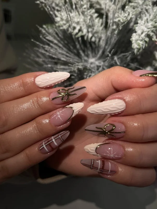 Cute Christmas nail designs inspired by cozy knitted sweaters with soft matte textured details.