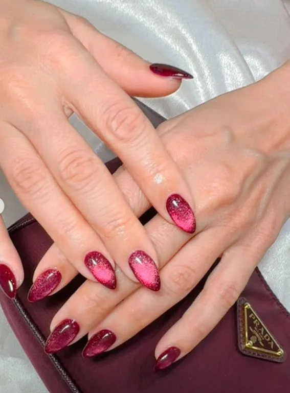 Long cat-eye velvet nails with magnetic shimmer creating a rich multidimensional finish.