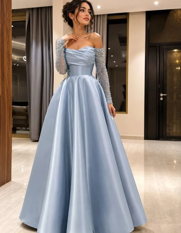 Dusty blue off-the-shoulder gown with sheer sleeves for an elegant prom look