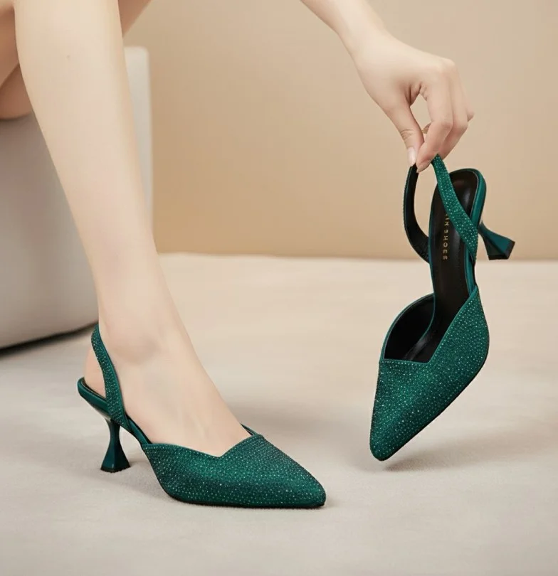 Deep pink dress styled with emerald green heels for a rich fashion-forward look.