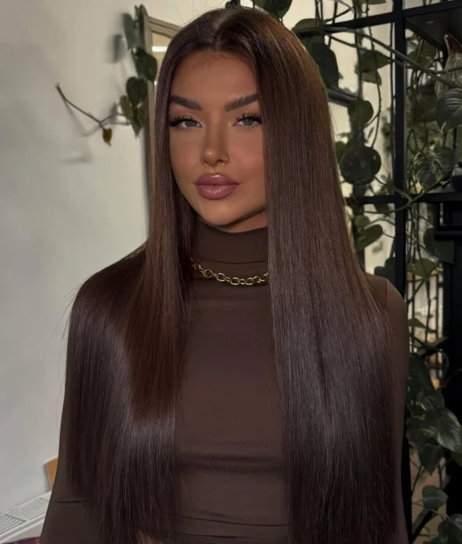 Sleek espresso brown hair creating deep contrast with a fair complexion.