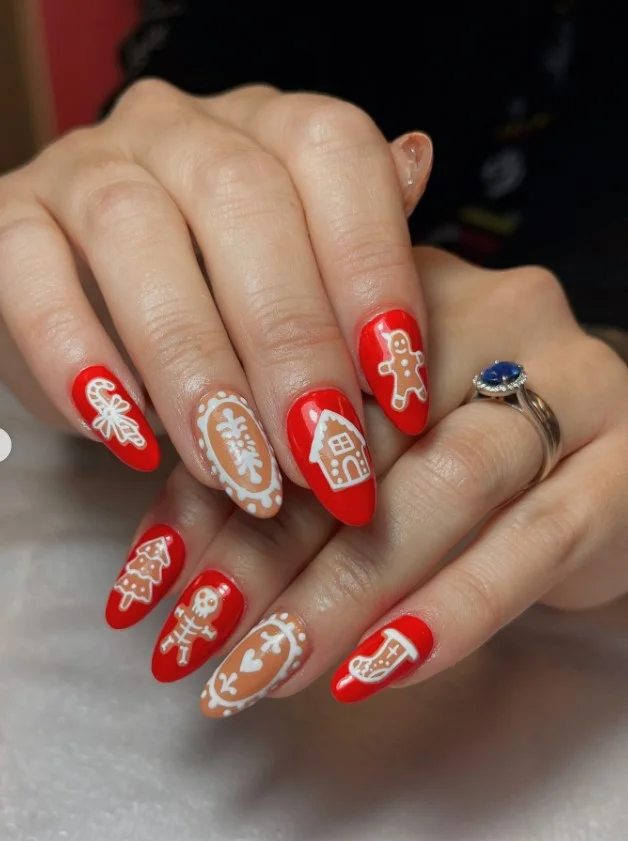 Cute Christmas nail designs with gingerbread cookie art, white icing details, and warm brown polish.