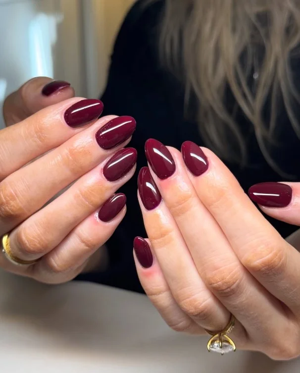 Glossy burgundy fall nail designs with a deep wine-inspired shine for a timeless autumn look.