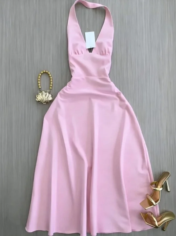 Pink satin dress styled with gold strappy heels for a wedding guest and evening celebration outfit.