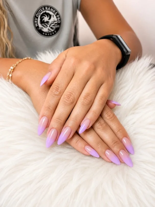 Long almond nails blending soft lavender into creamy vanilla with a flawless gradient finish.