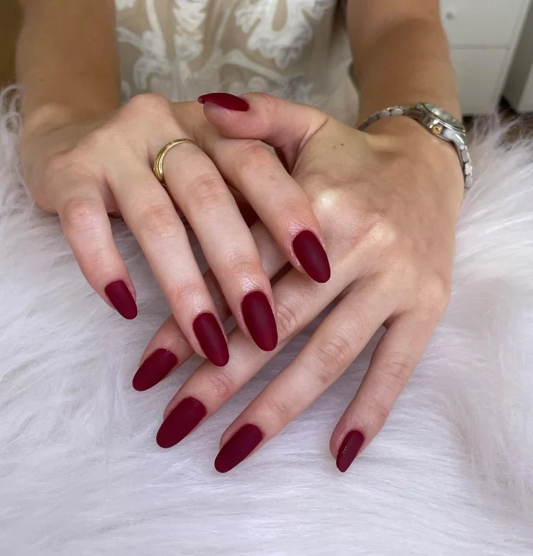 Matte burgundy fall nail designs with a soft velvety finish perfect for cozy autumn outfits.