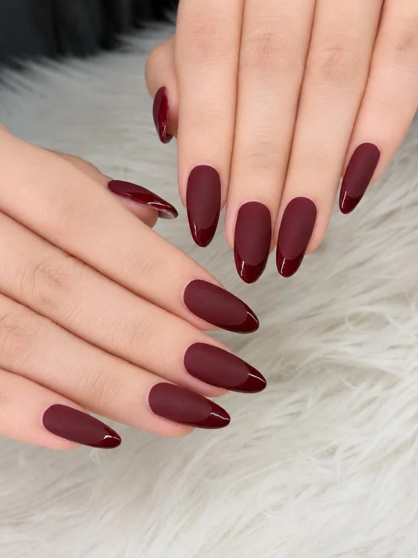 Matte red nail designs with matching glossy tips creating a sleek modern contrast manicure.