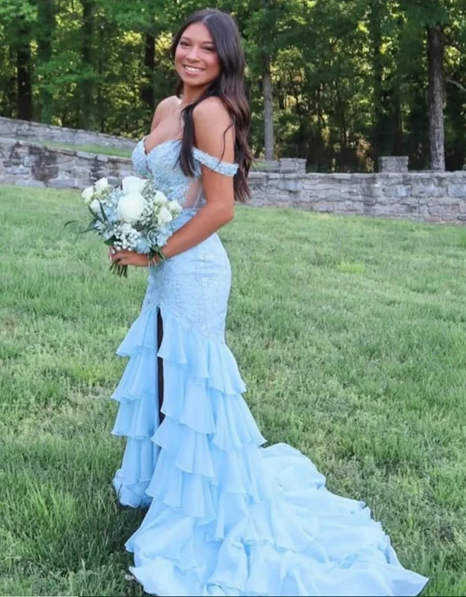 Off-the-shoulder sky blue prom dress styled with loose waves and drop earrings