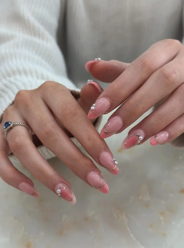 Pearl pink nails paired beautifully with a satin navy blue dress.