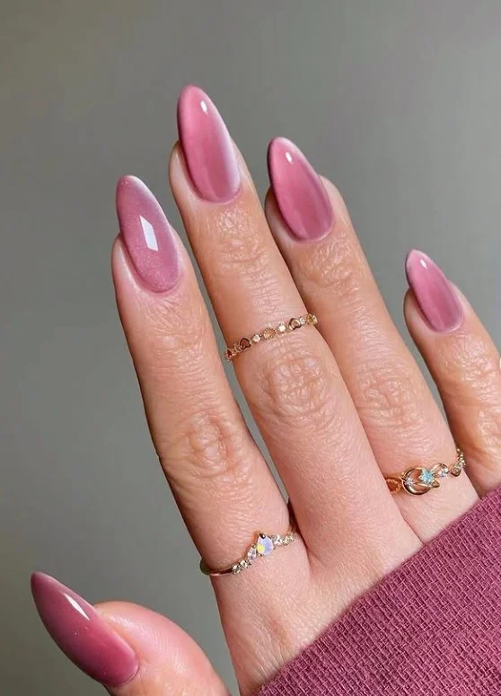Pink cat-eye velvet nail designs with magnetic shimmer creating a luxurious multidimensional finish.