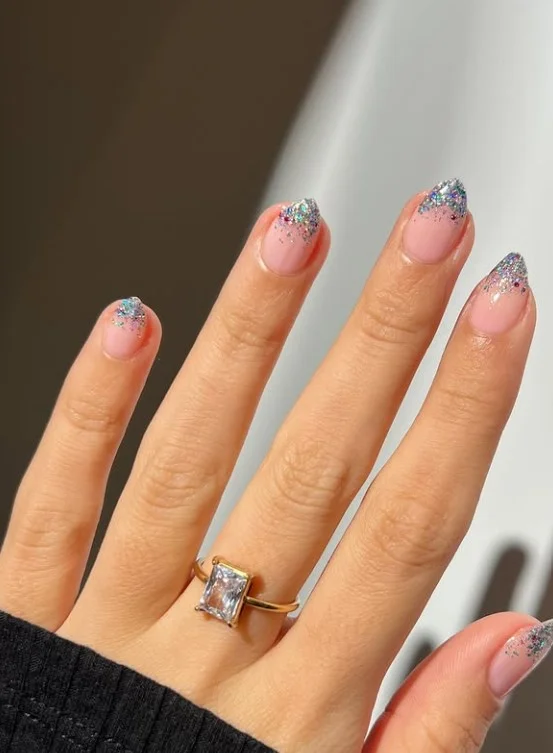 Pink glitter gradient nail designs with fine sparkling glitter fading across a glossy pink base.