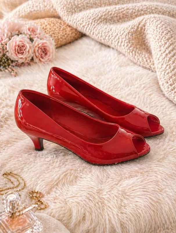 Bright pink cocktail dress styled with bold red heels for a confident fashion statement.
