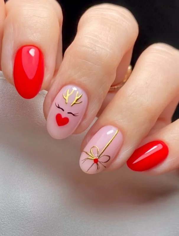 Cute Christmas nail designs with adorable reindeer nail art and classic holiday colors.