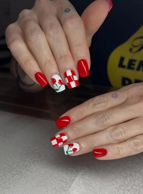Retro checkerboard red nail designs on square nails with vintage-inspired geometric patterns.
