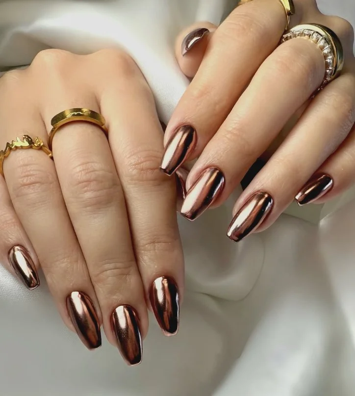 Square chrome nail designs featuring reflective rose gold metallic shine and smooth finish.