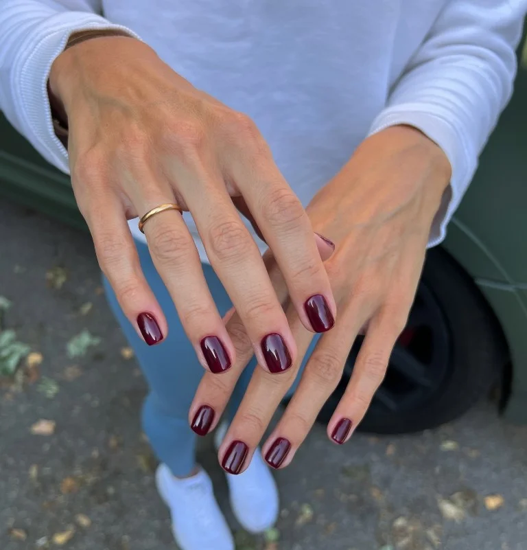 Short burgundy fall nail designs with a glossy finish for a clean and elegant everyday manicure.