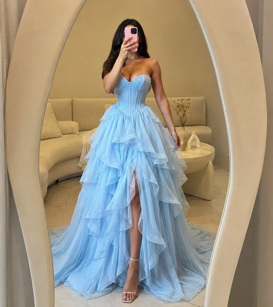 Sky blue corset prom dress with layered skirt and pearl accessories