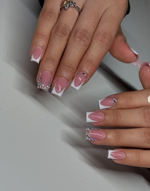 Square nail designs featuring tiny rhinestone cuticle accents on a clean glossy manicure.