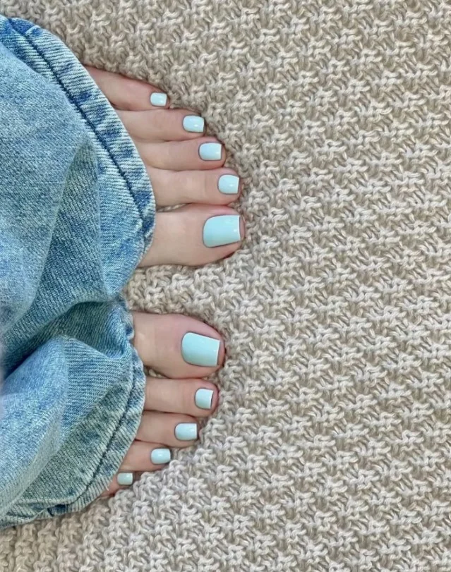 Bright summer toe nail designs with cheerful colors and a glossy seasonal finish.