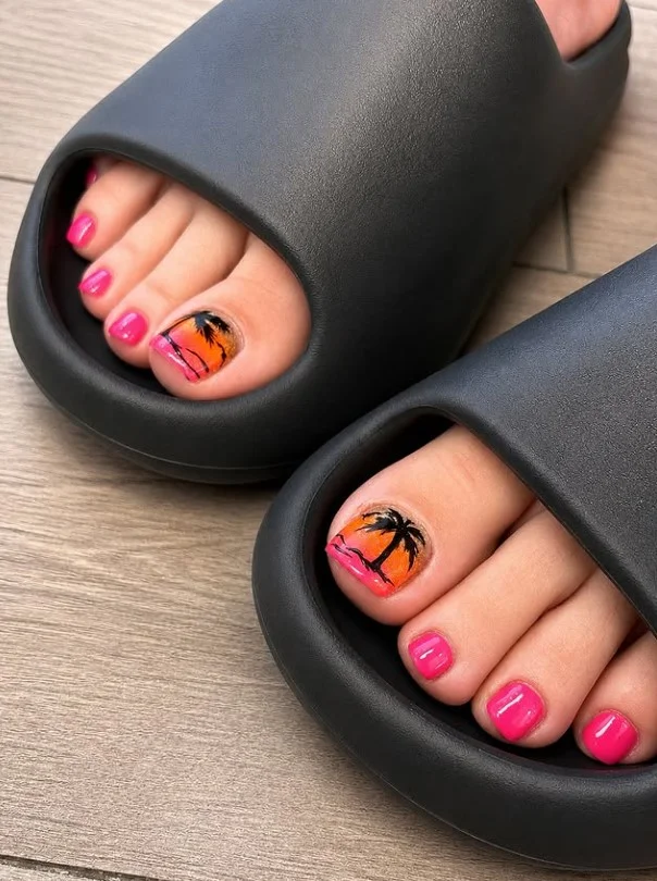 Tropical palm toe nail designs with hand-painted green leaf accents on a bright summer pedicure.