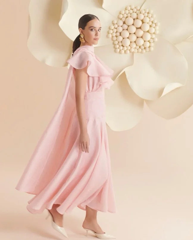 Light pink summer dress paired with white and ivory heels for a fresh daytime fashion look.