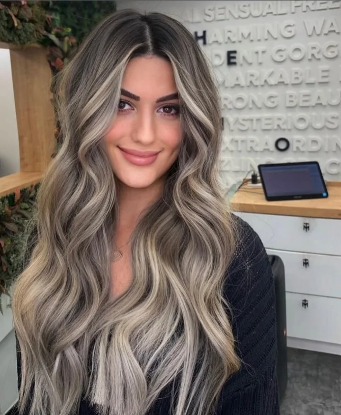 Ash blonde hair with cool undertones styled to complement a red-toned complexion.