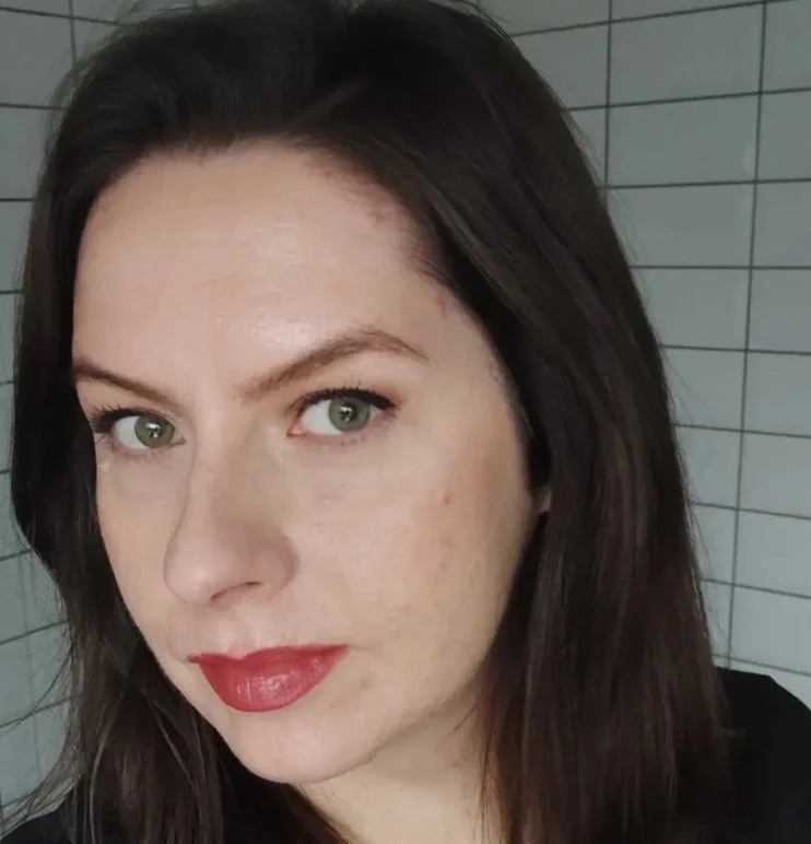 Berry rose lipstick creating a romantic evening makeup look for fair skin.