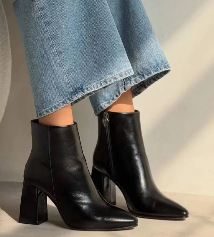 Wide leg jeans paired with block-heel boots for winter.