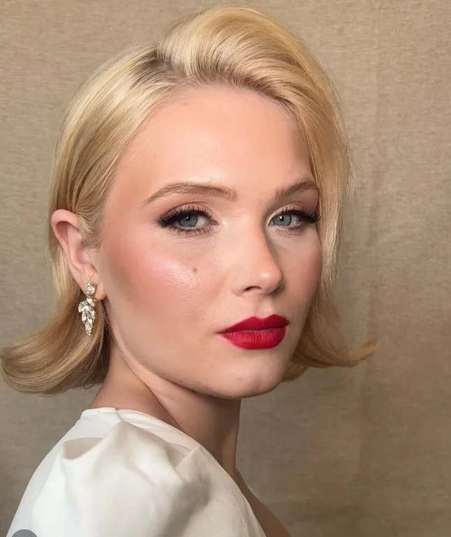 Blue-based red lipstick creating classic glamour on cool fair skin.