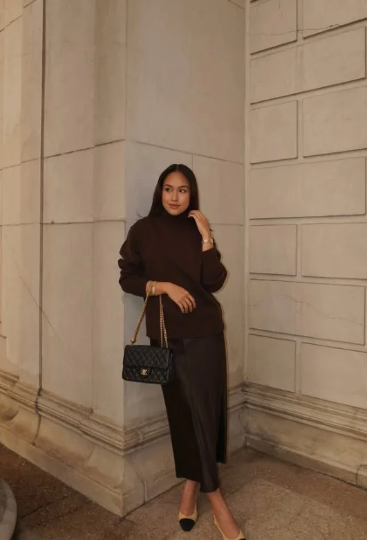 Chocolate brown clothing creating a deep polished look on warm skin tone