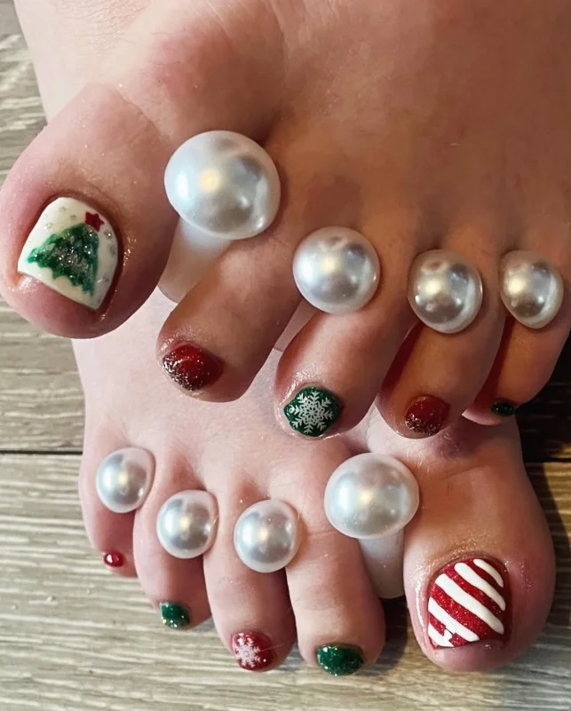 Christmas ornament toe nails decorated with colorful hanging ornament designs