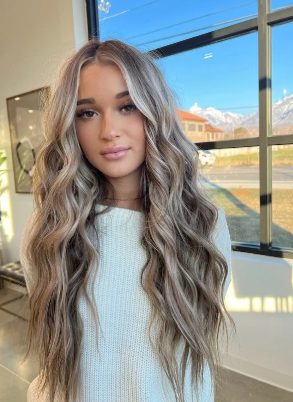 Cool bronde hair blending brown and blonde tones for a soft dimensional finish.
