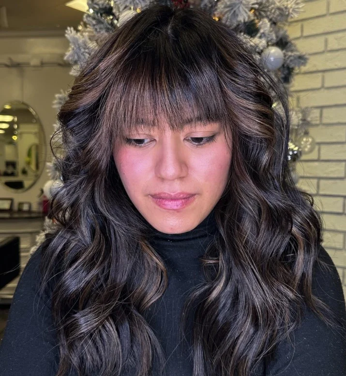 Cool caramel balayage adding blended brightness and dimension to brunette hair.