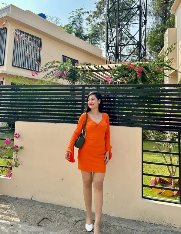 Coral clothing adding a bright feminine pop of color to warm skin