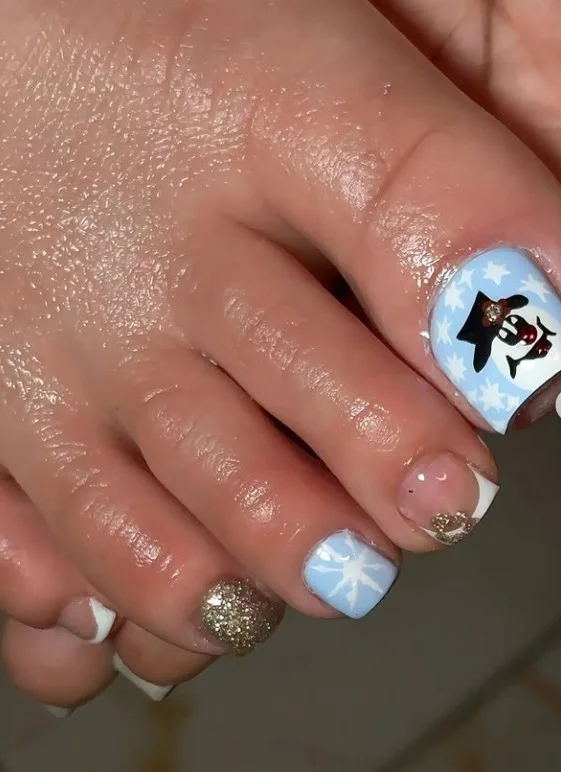 Frosty white Christmas toe nails with crisp white polish and a soft winter look
