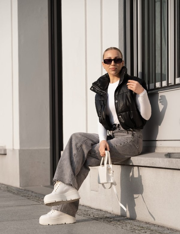 Wide leg jeans styled with platform sneakers for winter.