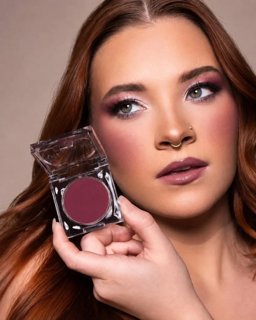 Deep plum blush adding sophisticated color to a cool olive complexion