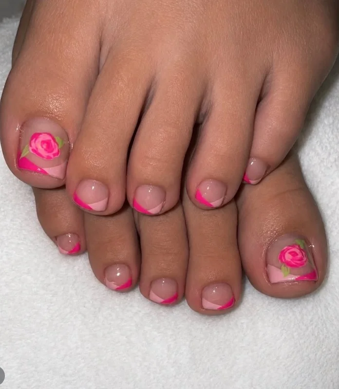 Rose toe nail design featuring detailed pink roses with subtle green leaf accents.