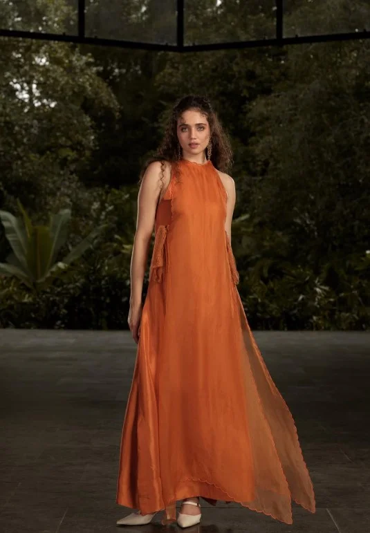 Rust orange outfit creating a rich autumn-inspired look for warm skin