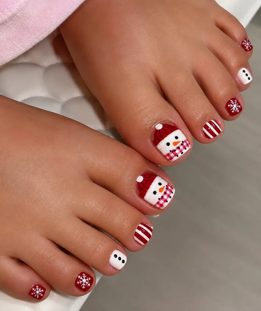 Snowman toe nails with cute white snowmen and small winter details on the big toes