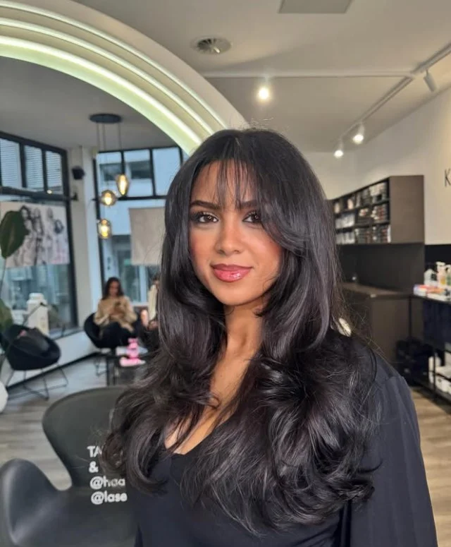 Soft black-brown hair offering rich depth without the harshness of jet black.