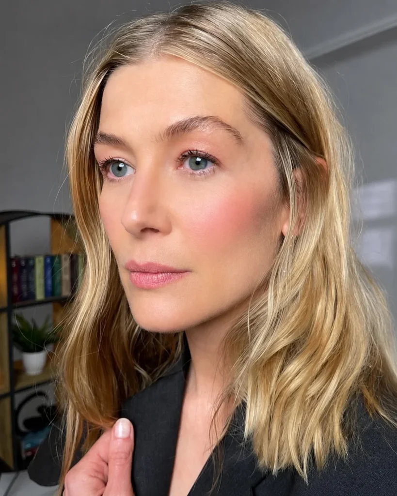 Soft pink blush adding delicate natural color to light olive skin