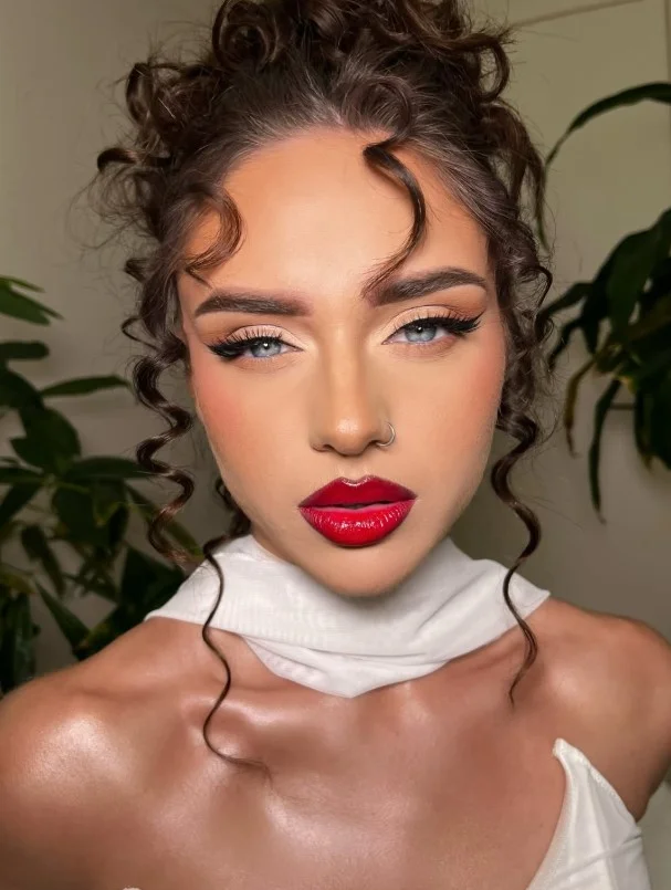 True red lipstick creating a timeless statement look for a fair complexion.