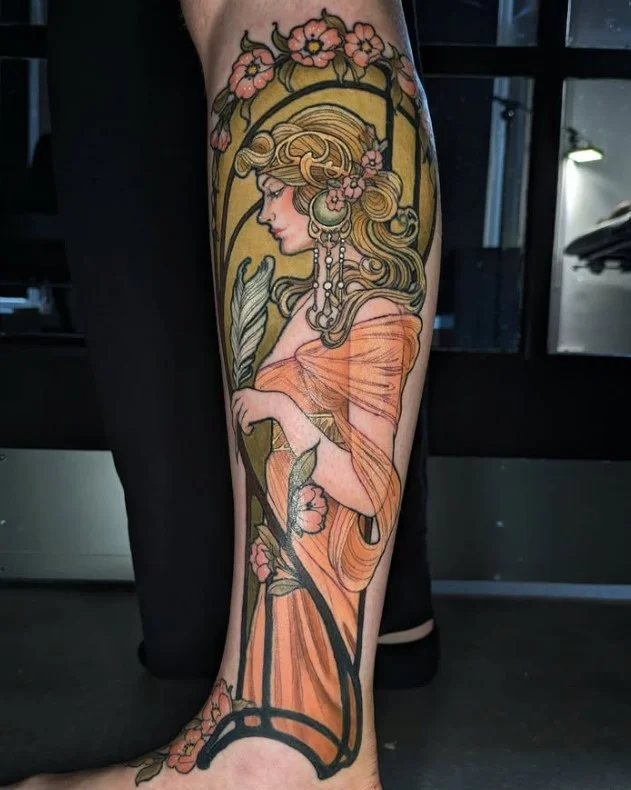 Art Nouveau half leg tattoo for women with elegant curves and floral details