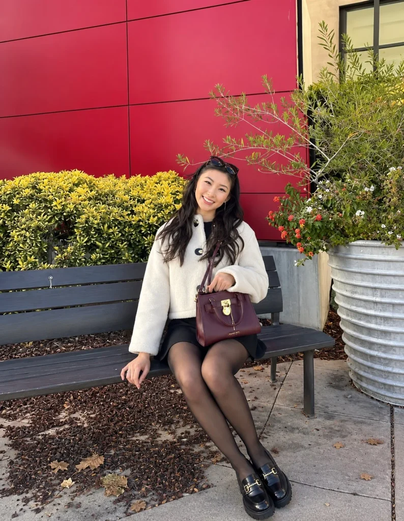 Black mini skirt with tights and chunky loafers