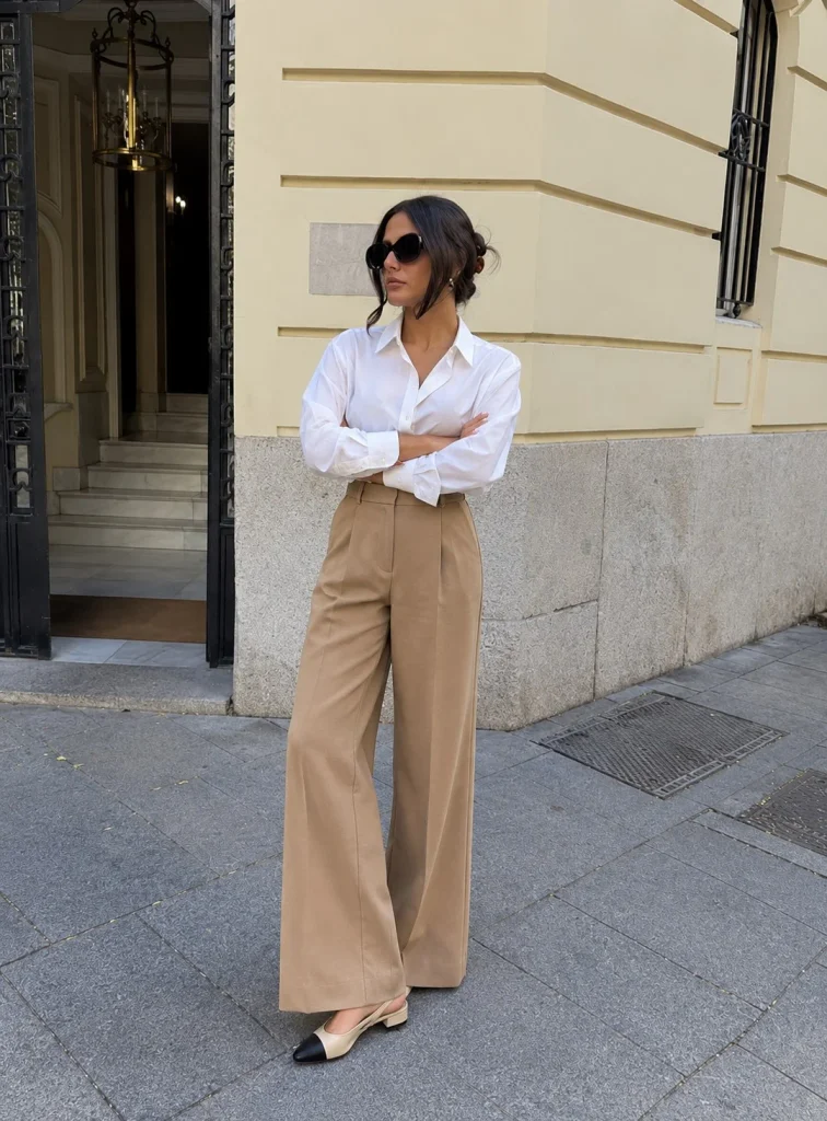 Woman wearing camel wide-leg pants with a white shirt and slingback flats
