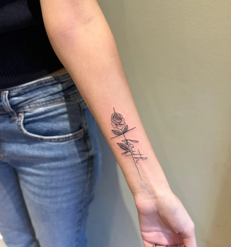 Fine-line rose forearm tattoo with a delicate floral design