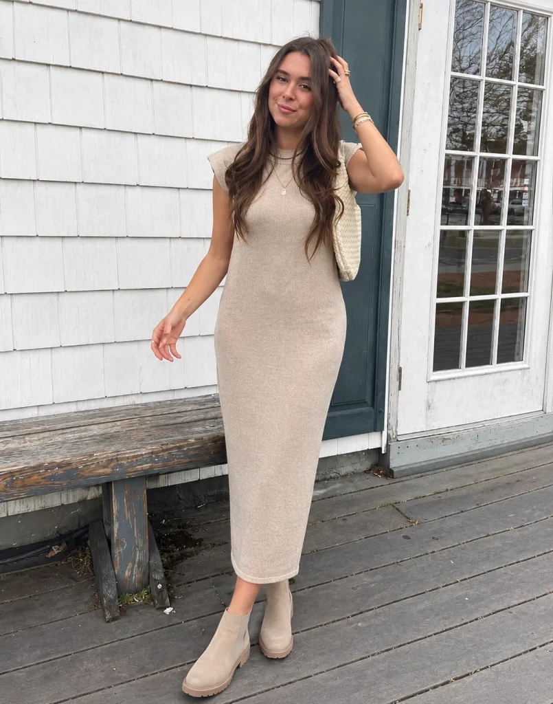 Woman wearing beige Chelsea boots with a knit midi dress